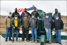  ??  ?? Taos VFW Post 3259 members stand in front of the cannon they helped relocate to NFO’s veterans memorial park.
Right: Honor guard coordinato­r Jeff Padilla (center) chats with fellow VFW Post 3259 members Saturday (Jan. 23).