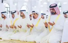  ?? WAM ?? Shaikh Humaid Bin Rashid Al Nuaimi and Shaikh Ammar Bin Humaid Al Nuaimi perform Eid prayers at the Shaikh Rashid Bin Humaid Al Nuaimi Mosque in Ajman.