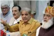  ?? — AFP ?? Shahbaz Sharif ( in yellow shirt) gestures as he speaks during an All Opposition Parties Conference in Islamabad.