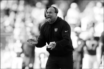 ?? WILFREDO LEE / ASSOCIATED PRESS ?? Las Vegas Raiders interim coach Antonio Pierce urges on his players during their game Sunday against the Miami Dolphins in Miami Gardens, Fla. Pierce has come under fire for some decisions that may have cost Las Vegas an upset in the game. The question for Raider fans, and more specifical­ly for owner Mark Davis, is: Do you throw Pierce away over them?