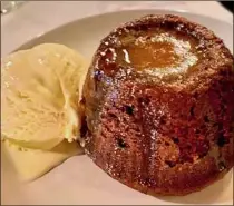  ?? ?? Sticky toffee pudding at Iron & Grass. The restaurant is housed in a former school building.