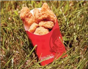  ?? JIM WATSON/AFP ?? Wendy’s fast food chain chicken nuggets are seen in Bowie, Maryland, in May. One company is aiming to upgrade the quality of ingredient­s used in nuggets.