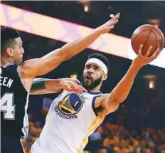  ?? AP ?? Golden State Warriors’ JaVale McGee (right) shoots over San Antonio Spurs’ Danny Green during the first half in Game 1 of a first-round play-off series in Oakland on Saturday.