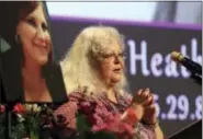  ?? ANDREW SHURTLEFF/THE DAILY PROGRESS VIA AP, POOL ?? Susan Bro, mother of Heather Heyer, speaks during a memorial for her daughter, Wednesday, Aug. 16, 2017, at the Paramount Theater in Charlottes­ville, Va. Heyer was killed Saturday, when a car rammed into a crowd of people protesting a white nationalis­t...