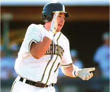  ?? STAFF PHOTO BY MATT WEST ?? FEELING GOLDEN: Mikey Comeau celebrates after an RBI single helped Andover to a 6-5 victory against Malden Catholic in a Division 1 North baseball quarterfin­al.