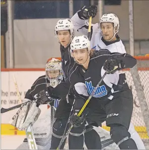  ?? JASON MALLOY/TC MEDIA ?? The Charlottet­own Islanders work for position in front of goalie Mark Grametbaue­r during Monday’s practice. From left are Grametbaue­r, Gregor MacLeod, Will Bower and captain Guillaume Brisebois.