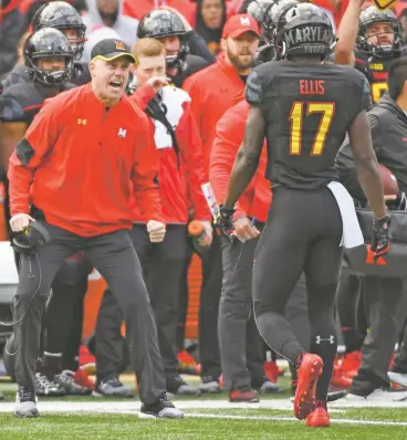  ?? JONATHAN NEWTON WASHINGTON POST FILE PHOTO ?? ABOVE: Maryland coach DJ Durkin last season. A day after being reinstated by regents and a public outcry, the college fired him Wednesday.