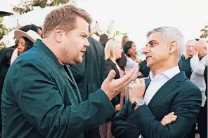  ?? ?? Sadiq Khan talks to James Corden, the actor and TV presenter, at a reception for the creative industries hosted by the Mayor of London in Hollywood, California, on a visit to the US in an attempt to boost London’s tourism industry