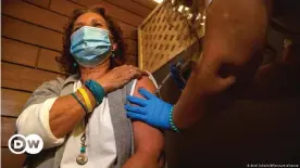  ??  ?? Woman in Israel getting vaccinated before the country rescinded the mandatory wearing of facemasks