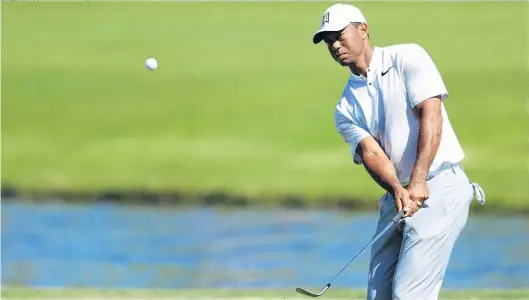  ?? PHOTO: GETTY IMAGES ?? Still firm fan favourite . . . American Tiger Woods plays a shot from a bunker during a practice round for the Players Championsh­ip which starts at TPC Sawgrass in Ponte Vedra Beach, Florida, tomorrow.