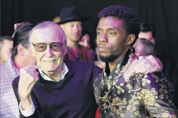  ?? Chris Pizzello / Invision / AP ?? In this Monday, Jan. 29, 2018 file photo, comic book legend Stan Lee, left, creator of the “Black Panther” superhero, poses with Chadwick Boseman, star of the “Black Panther” film, at the premiere at The Dolby Theatre in Los Angeles.