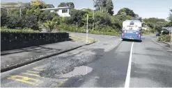  ?? MARTIN DE RUYTER/ STUFF ?? Road damage at the bus stop at the Atawhai Drive and Brooklands Rd intersecti­on in Nelson.