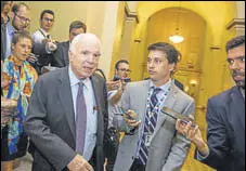  ?? AFP ?? Senator John McCain leaves the Senate Chamber vote against a strippeddo­wn version of Obamacare.