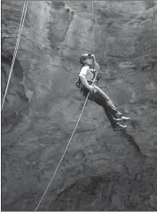  ?? U.S. Bureau of Land Management/Associated Press ?? Field manager Delissa Minnick descends into Natural Trap Cave in northern Wyoming. A third season of excavation­s in the cave in July uncovered bison, wolf, lion and cheetah remains from the end of the last ice age around 12,000 years ago.