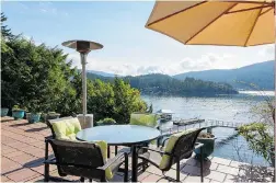  ??  ?? This Deep Cove property at 4701 Strathcona Pl., North Vancouver, with uninterrup­ted ocean views from a private patio, has 3,013 square feet.