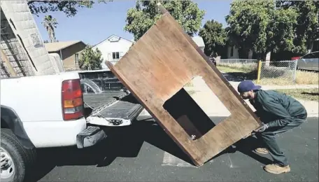  ?? Photograph­s by Mel Melcon Los Angeles TImes ?? LUIS HURTADO, 30, is believed to be the only City Council aide whose position is solely dedicated to clearing streets and alleys of trash.