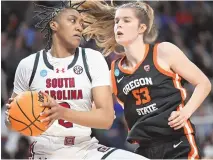  ?? HANS PENNINK/ ASSOCIATED PRESS ?? South Carolina forward Ashlyn Watkins (2) drives against Oregon State forward Kelsey Rees (53) during their NCAA Tournament Elite 8 game Sunday in Albany, N.Y.