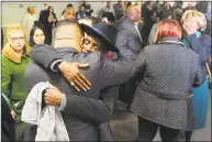  ?? Ned Gerard / Hearst Connecticu­t Media ?? State Rep. Chris Rosario and Bridgeport City Councilman Ernie Newton embrace prior to a moment of silence in memory of state Rep. Ezequiel Santiago at the Morton Government Center in Bridgeport on Friday. Santiago died overnight at age 45.