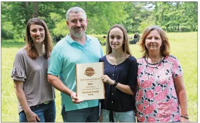  ?? PHOTOS BY SAM PIERCE/TRILAKES EDITION ?? The Stockton family of the Okolona community was selected as Clark County Farm Family of the Year. From left are Bethany Stockton, Dustin Stockton, daughter Georgia Kate and Dustin’s mother, Pat Rowe. The family raises hay, timber and livestock on 550 acres that have been in the family for 135 years.