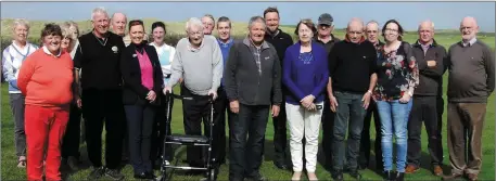  ??  ?? Mike Dowd, centre, pictured on his final day at Castlegreg­ory Golf Club. Mike was the head groundkeep­er for over 24 years at the West Kerry links. Pictured, front from left: Joan Cantillon, Tommy King, Mens Captain, Geraldine Flynn, Ladies Captain,...