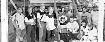  ??  ?? Paulus (front row, fourth left), Mary (seated left), Ekit (standing fourth right) with Saberkas Batu Danau members having a photo call at Inap’s house in Lubuk Bidai.