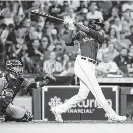  ?? Karen Warren / Staff photograph­er ?? Yordan Alvarez hits a home run off Tyler Anderson during the second inning of a 6-3, 11-inning loss to the Mariners on Sunday at Minute Maid Park.