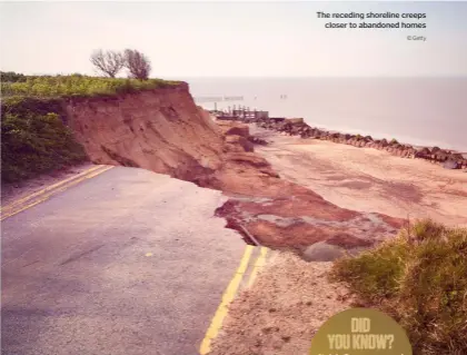  ?? © Getty ?? The receding shoreline creeps closer to abandoned homes