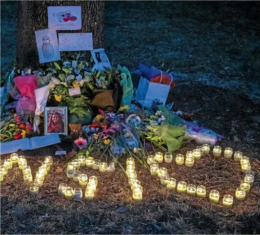  ?? GETTY IMAGES ?? Candles are lit around pictures and messages at a tribute to 25-year-old masters student Ansi Alibava near Al-Noor mosque on Tuesday. Fifty people have died and dozens were injured after a gunman opened fire at two Christchur­ch mosques on Friday.