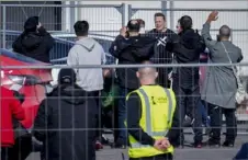  ?? Ebrahim Noroozi/Associated Press ?? Tesla CEO Elon Musk, fourth from right, arrives at the Tesla Gigafactor­y for electric cars in Gruenheide near Berlin on Wednesday.