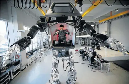  ?? Picture: REUTERS ?? STEPPING OUT: A pilot controls a walking robot Method-2 during a demonstrat­ion in Gunpo, South Korea, yesterday