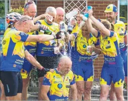  ??  ?? The Land’s End to Margate bike ride team soaking Sean Calnan as a thanks for the ride idea