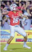  ?? ROBERTO E. ROSALES/JOURNAL ?? UNM freshman quarterbac­k Tevaka Tuioti came off the bench to give the Lobos a spark against New Mexico State.