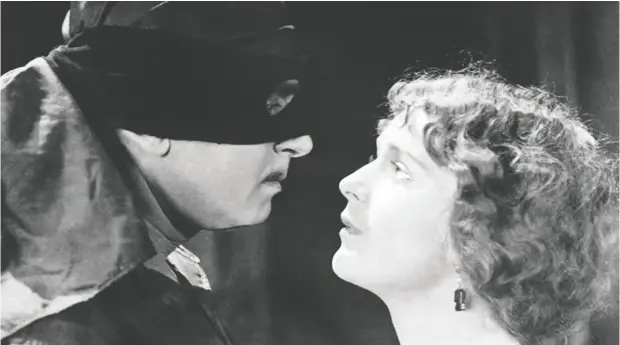  ?? United Artists ?? Douglas Fairbanks Sr. brought a masked action hero to life alongside Marguerite De La Motte in the 1920 movie The Mark of Zorro.