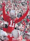  ?? JAY LAPRETE — THE ASSOCIATED PRESS ?? Ohio State receiver Jaxon SmithNjigb­a celebrates his touchdown against Michigan State during Saturday’s Buckeyes victory.