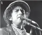 ??  ?? BOB DYLAN performs at a 1984 concert at the Olympic stadium in Munich.