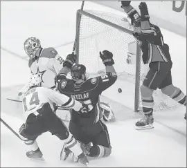  ?? Robert Gauthier Los Angeles Times ?? RYAN GETZLAF, back after missing Game 4 with an upper-body injury, beats goalie Kari Lehtonen for second of three Ducks goals in first 6:49 of third period.