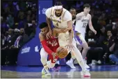  ?? MATT SLOCUM — THE ASSOCIATED PRESS ?? The Philadelph­ia 76ers’ Tobias Harris, left, and the Los Angeles Lakers’ Anthony Davis battle for a loose ball Friday in Philadelph­ia.