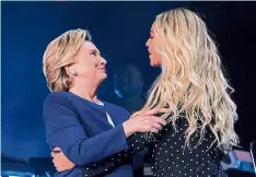  ?? — Reuters ?? Star support: Clinton joining Beyonce at a campaign concert in Cleveland, Ohio.