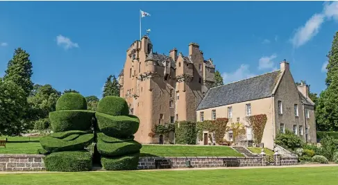  ?? ?? Crathes Castle in Aberdeensh­ire has a historic walled garden and iconic yew hedges, planted as early as 1702.