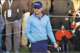  ?? Patrick T. Fallon For The Times ?? JUSTIN THOMAS watches another errant putt during the fourth round of the Genesis Open. He squandered a four-shot lead and finished second to J.B. Holmes.