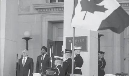  ?? CLIFF OWEN, THE ASSOCIATED PRESS ?? Defense Secretary Jim Mattis and Canadian Defense Minister Harjit Sajjan stand for the National Anthem of Canada during an Honor Cordon at the Pentagon, Monday.