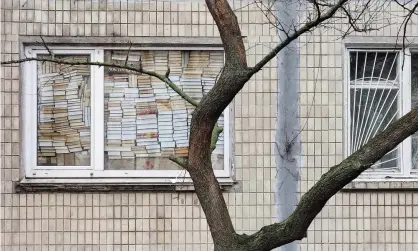  ?? ?? A window barricaded by books in Kyiv. Photograph: Lev Shevenko