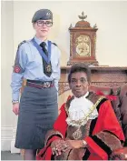  ??  ?? ●● Alift HarewoodJo­nes becomes new mayor of Macclesfie­ld, pictured with her cadet Emily Storer