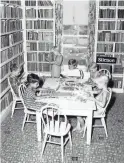  ??  ?? Children sit at a table inside the Desert Mission library to read. The library was built in 1929 as a place to provide people who had moved to the area for tuberculos­is recovery something to do.