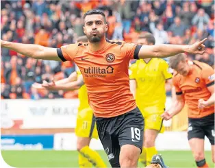  ??  ?? Dundee United’s Rachid Bouhenna turns away to celebrate his goal