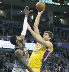  ?? Sue Ogrocki/Associated Press ?? Brook Lopez, right, led Los Angeles with 20 points in the Lakers’ 108-104 win Sunday against Oklahoma City.