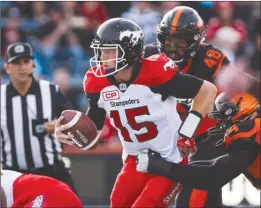  ?? The Canadian Press ?? B.C. Lions players sack Calgary Stampeders quarterbac­k Andrew Buckley during CFL pre-season action in Calgary last Tuesday. A study found that domestic violence calls were 15 per cent higher when the Stampeders faced off against the rival Edmonton...