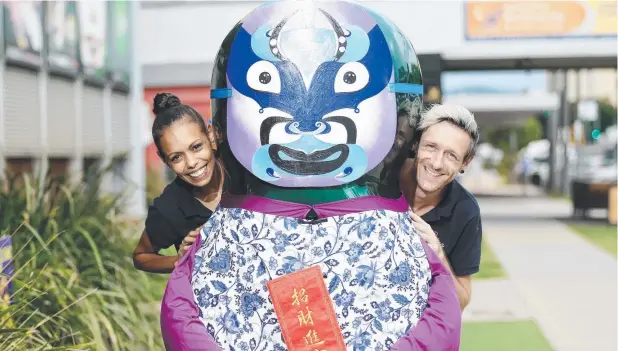  ?? Picture: JUSTIN BRIERTY ?? CITY READY TO CELEBRATE: Naomi Mabo and Ben Hardie get cosy with one of the dressed up “jelly babies” at the Centre of Contempora­ry Arts.