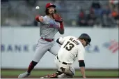  ?? D. ROSS CAMERON — THE ASSOCIATED PRESS ?? Cincinnati Reds second baseman Jonathan India (6) throws over San Francisco Giants’ Austin Slater (13) too late to double up Donovan Solano at first during the first inning of a baseball game, Monday in San Francisco