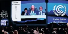  ?? REUTERS ?? A SCREEN shows COP27 President Sameh Shoukry delivering a statement during the closing plenary at the UN climate summit in Sharm el-Sheikh, Egypt, last Sunday. |